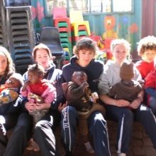 Students from Ballakermeen High School with orphaned children.